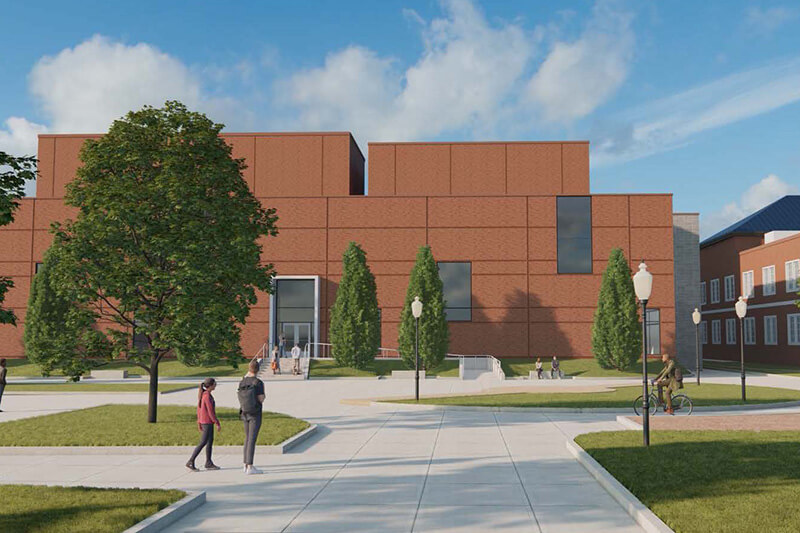 A digital rendering of a modern campus scene with a large, brick building, trees, and people walking.