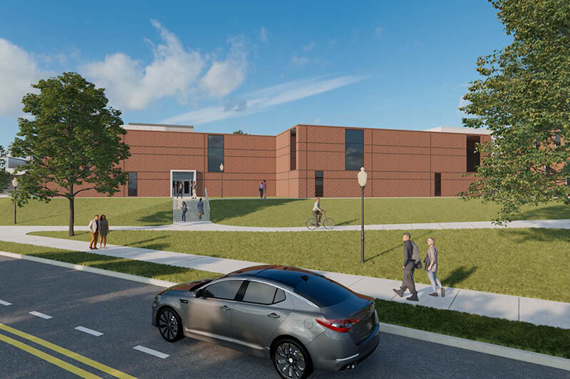 A digital rendering of a red brick building with vertical windows, set on a grassy hill with stairs, and a parked silver sedan nearby.