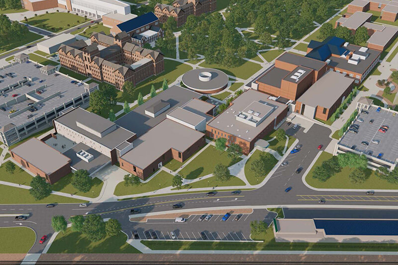 A digital rendering of an aerial view of a campus with modern and traditional buildings, greenery, and parking lots.