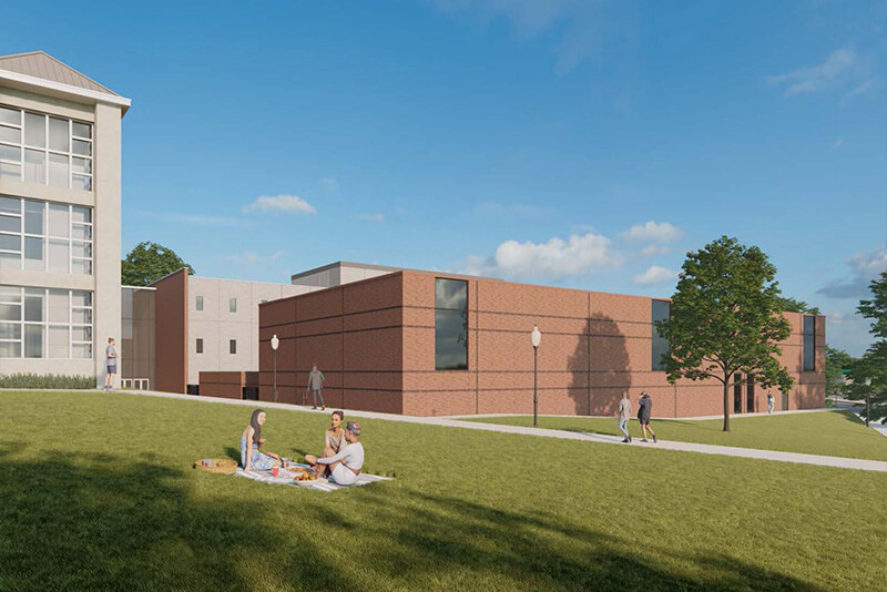 A digital rendering of a campus scene with people picnicking on a lawn near modern brick and gray buildings under a blue sky.